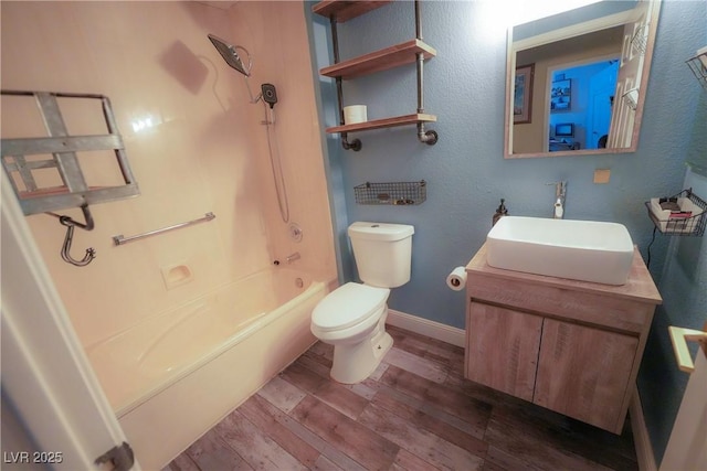 9000 Litchfield Ave, Las Vegas, NV 89134 - bathroom featuring shower / tub combination, wood finished floors, baseboards, vanity, and toilet