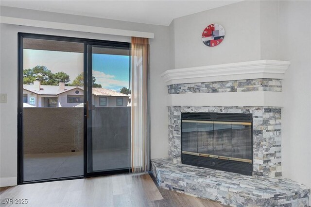 2451 N Rainbow Blvd Unit 2144, Las Vegas, NV 89108 - detailed view of wood finished floors and a fireplace