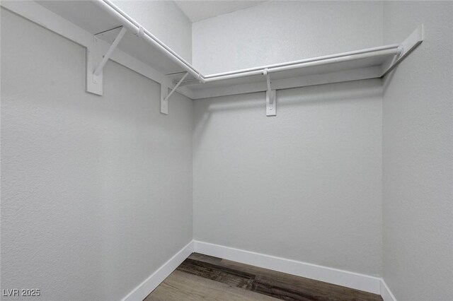 2451 N Rainbow Blvd Unit 2144, Las Vegas, NV 89108 - walk in closet with dark wood finished floors