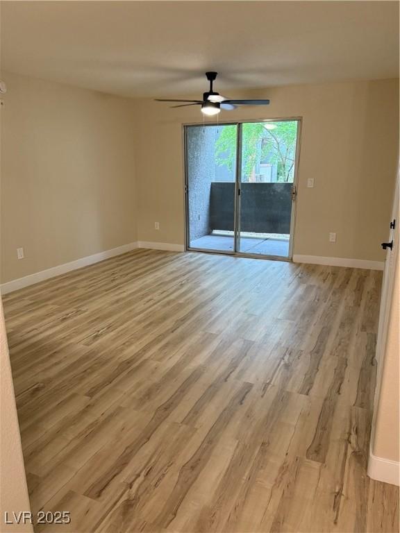 unfurnished room featuring baseboards, ceiling fan, and light wood finished floors