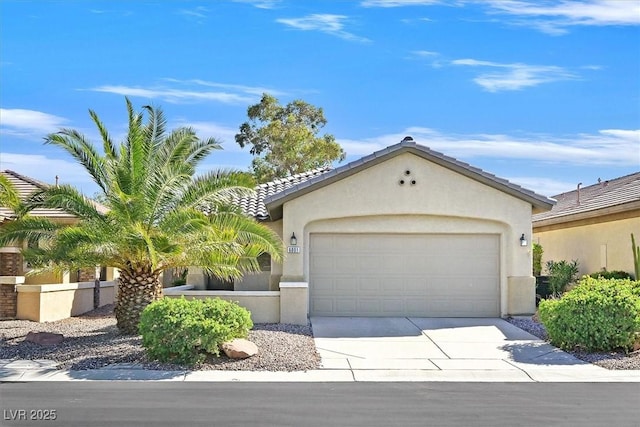 6001 Falconer Ave, Las Vegas, NV 89122 - view of front of property with stucco siding, an attached garage, and driveway