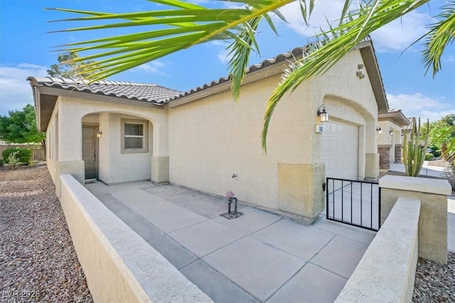 6001 Falconer Ave, Las Vegas, NV 89122 - view of patio / terrace featuring a garage