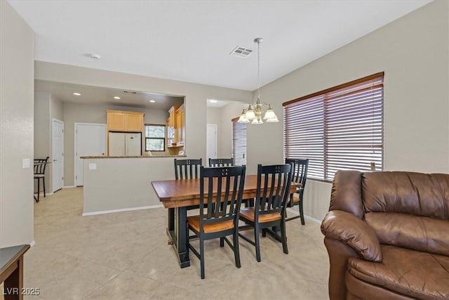 6001 Falconer Ave, Las Vegas, NV 89122 - dining area featuring a chandelier, recessed lighting, baseboards, and light tile patterned flooring