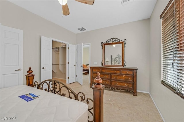 6001 Falconer Ave, Las Vegas, NV 89122 - bedroom with baseboards, a spacious closet, ceiling fan, and a closet