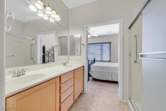 6001 Falconer Ave, Las Vegas, NV 89122 - ensuite bathroom featuring a shower stall, tile patterned flooring, and double vanity