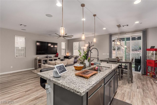 39 Castleton Tower Ct, Henderson, NV 89011 - kitchen featuring a sink, a healthy amount of sunlight, light wood-style flooring, and visible vents
