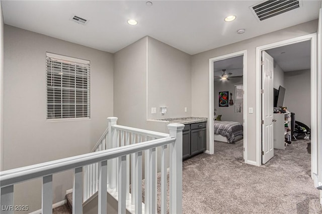 39 Castleton Tower Ct, Henderson, NV 89011 - hall featuring recessed lighting, visible vents, light carpet, and an upstairs landing