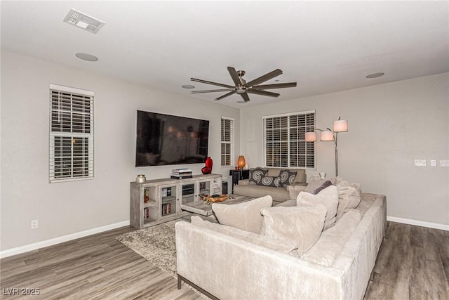 39 Castleton Tower Ct, Henderson, NV 89011 - living room with baseboards, ceiling fan, wood finished floors, and visible vents