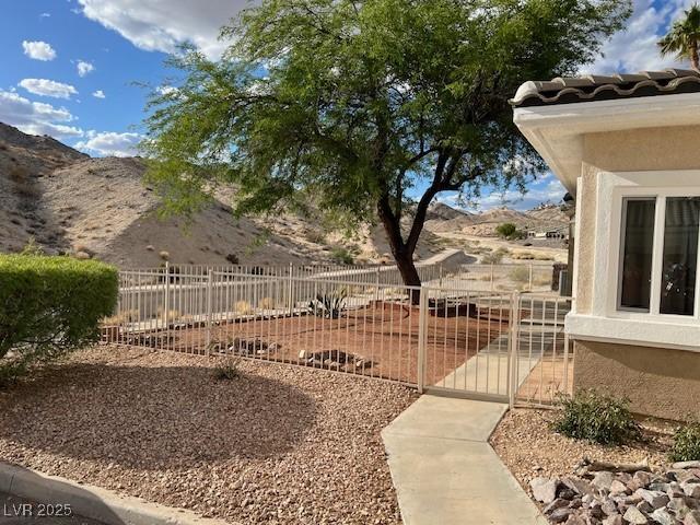 3349 Partridge Run St, Laughlin, NV 89029 - view of yard with a gate and a mountain view