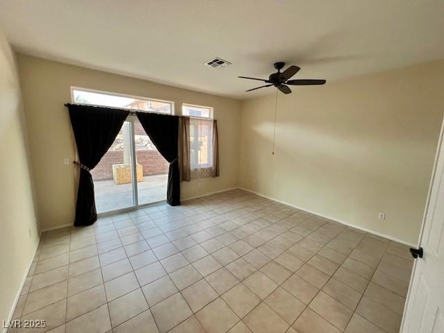 3349 Partridge Run St, Laughlin, NV 89029 - unfurnished room featuring ceiling fan, light tile patterned flooring, and baseboards