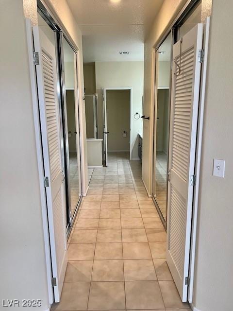 3349 Partridge Run St, Laughlin, NV 89029 - corridor featuring light tile patterned flooring
