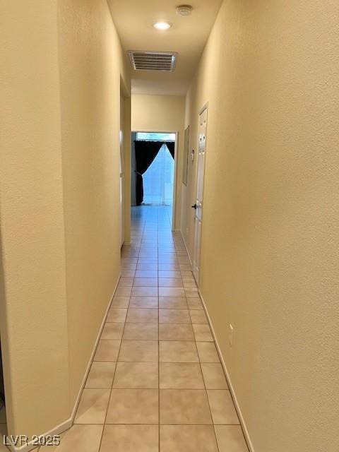 3349 Partridge Run St, Laughlin, NV 89029 - hallway with light tile patterned floors