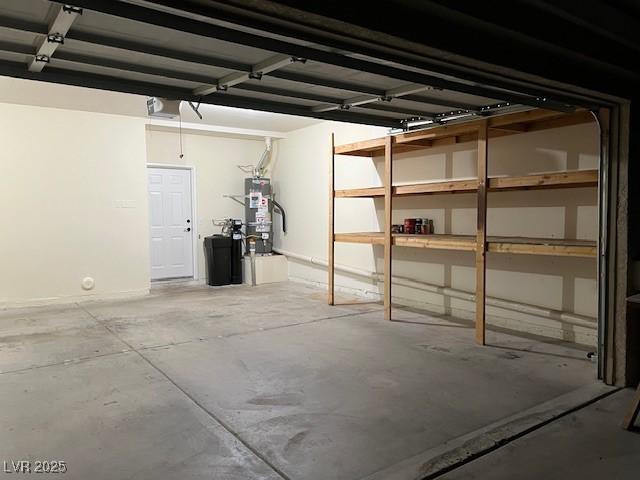 3349 Partridge Run St, Laughlin, NV 89029 - garage featuring strapped water heater and a garage door opener