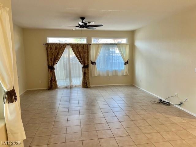 3349 Partridge Run St, Laughlin, NV 89029 - spare room featuring light tile patterned floors, a ceiling fan, and baseboards