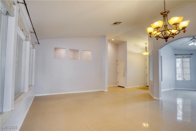 2383 Rainswept Ave, Henderson, NV 89052 - interior space with visible vents, arched walkways, vaulted ceiling, baseboards, and ceiling fan with notable chandelier