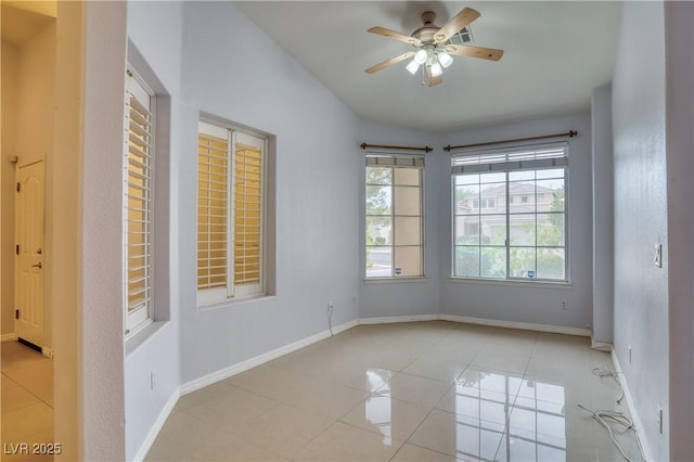 2383 Rainswept Ave, Henderson, NV 89052 - spare room with vaulted ceiling, baseboards, tile patterned flooring, and a ceiling fan
