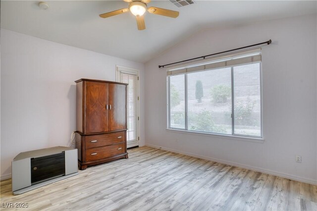 2383 Rainswept Ave, Henderson, NV 89052 - unfurnished bedroom featuring baseboards, a ceiling fan, light wood finished floors, and vaulted ceiling