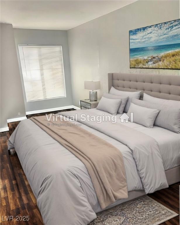 bedroom with baseboards and wood finished floors