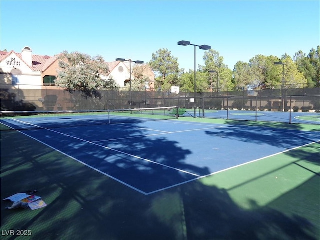 view of sport court with community basketball court and fence