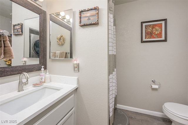 2240 Highpointe Dr Unit 203, Laughlin, NV 89029 - full bath with toilet, baseboards, vanity, and wood finished floors