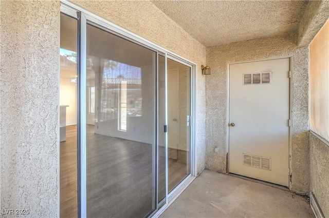 5710 E Tropicana Ave Unit 1017, Las Vegas, NV 89122 - view of exterior entry featuring stucco siding and visible vents