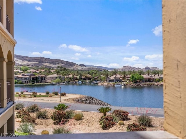 view of water feature featuring a residential view and a mountain view