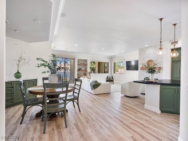 dining space with visible vents, light wood-style flooring, and recessed lighting