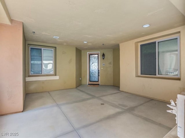 property entrance featuring a patio area