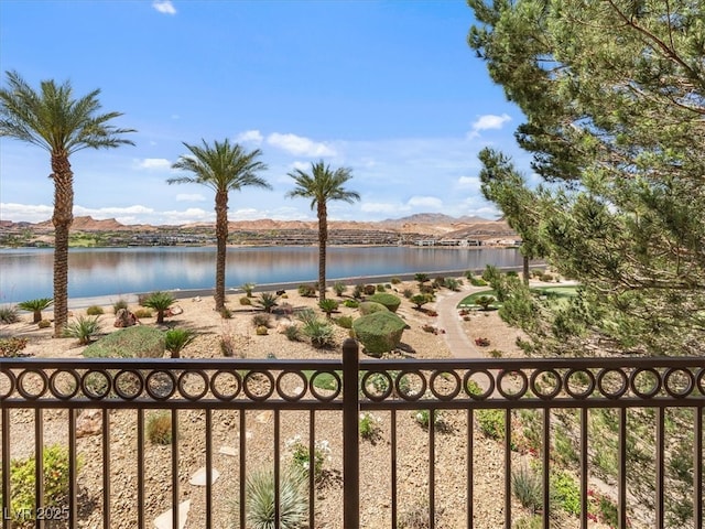 view of water feature with a mountain view and fence