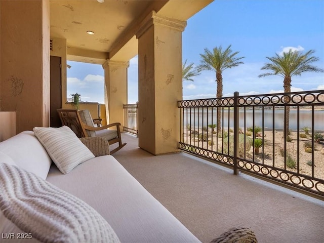 balcony featuring a water view