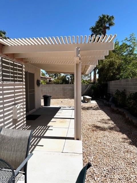 view of patio featuring a fenced backyard and a pergola