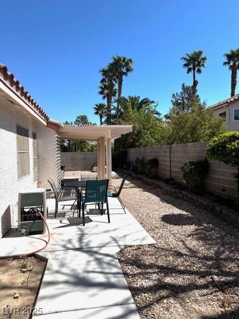 view of patio / terrace with a fenced backyard and outdoor dining space