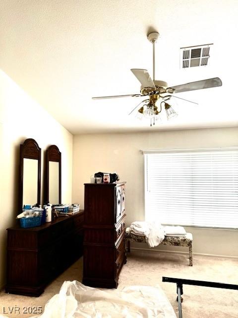 bedroom with a ceiling fan and visible vents