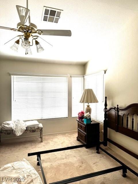 bedroom with carpet, visible vents, and baseboards