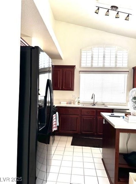 1812 Jack Rabbit Way, Las Vegas, NV 89128 - kitchen with a sink, light tile patterned floors, dark brown cabinets, and light countertops