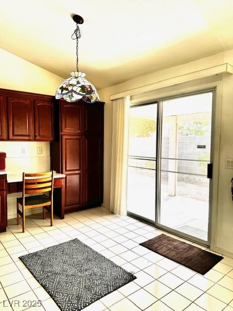 1812 Jack Rabbit Way, Las Vegas, NV 89128 - dining room with vaulted ceiling and light tile patterned flooring