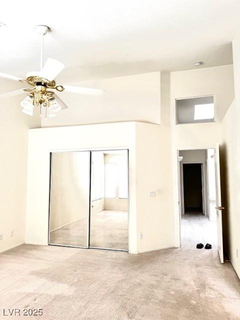 1812 Jack Rabbit Way, Las Vegas, NV 89128 - unfurnished bedroom featuring carpet, a closet, a high ceiling, and ceiling fan