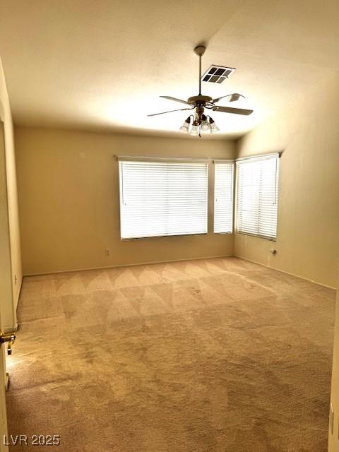 1812 Jack Rabbit Way, Las Vegas, NV 89128 - empty room featuring a ceiling fan and light colored carpet