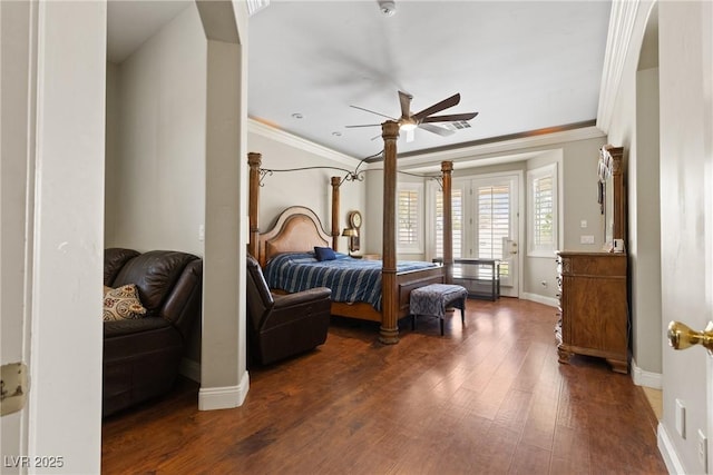 bedroom featuring crown molding, wood finished floors, baseboards, and ceiling fan