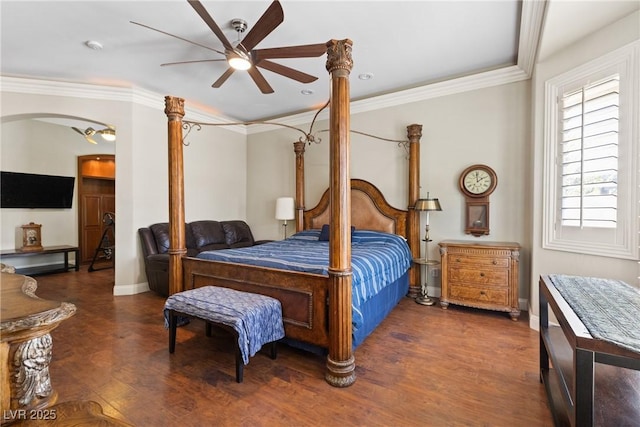 bedroom featuring a ceiling fan, wood finished floors, baseboards, and ornamental molding