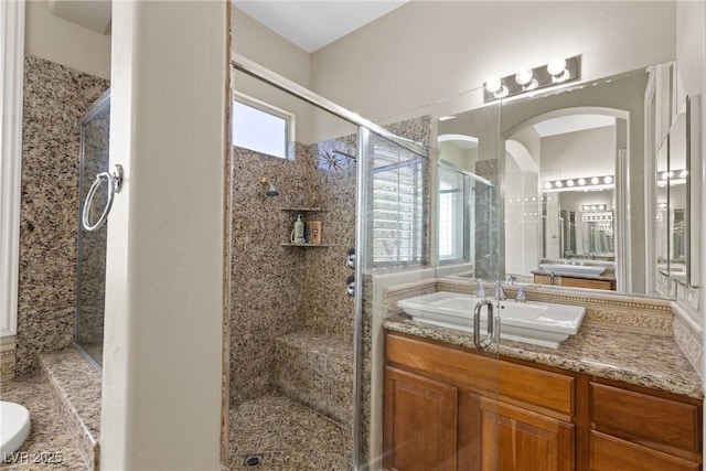 bathroom with vanity and a shower stall