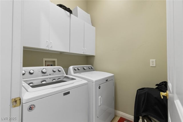 laundry room featuring cabinet space, washer and clothes dryer, and baseboards