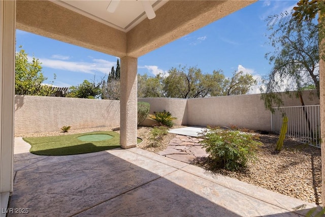 view of patio / terrace with a ceiling fan and a fenced backyard