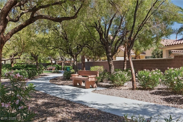 view of community featuring fence