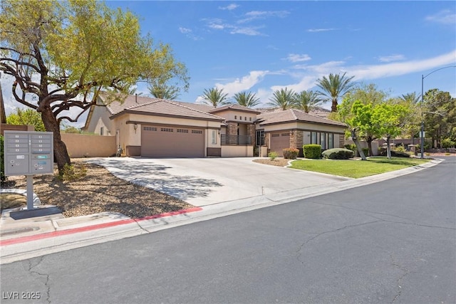 view of front of home with concrete driveway, stucco siding, fence, and a garage