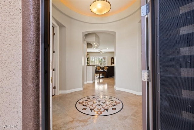 foyer entrance featuring baseboards