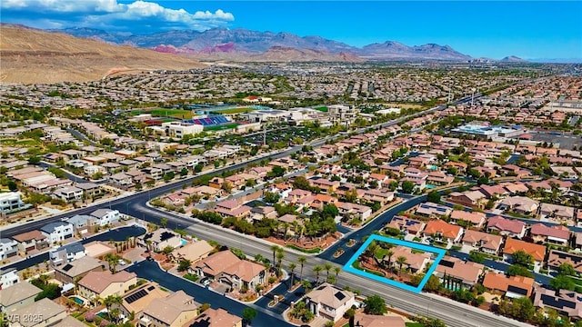 drone / aerial view featuring a mountain view and a residential view