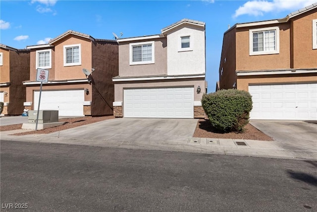 4076 Rocky Beach Dr, Las Vegas, NV 89115 - view of front facade with stone siding, stucco siding, driveway, and a garage