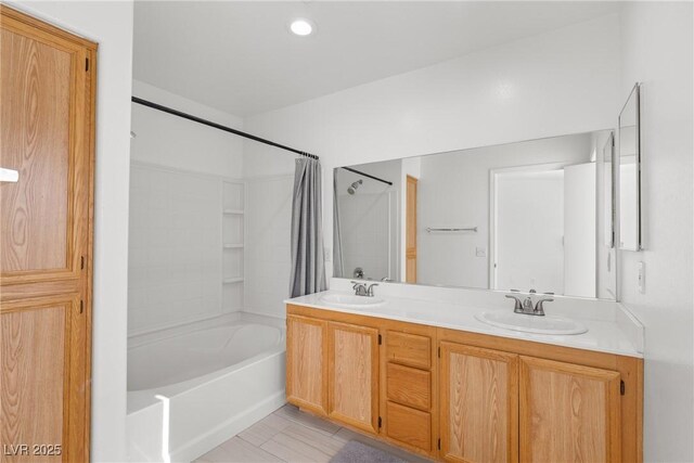 4076 Rocky Beach Dr, Las Vegas, NV 89115 - bathroom with a sink, double vanity, and shower / tub combo