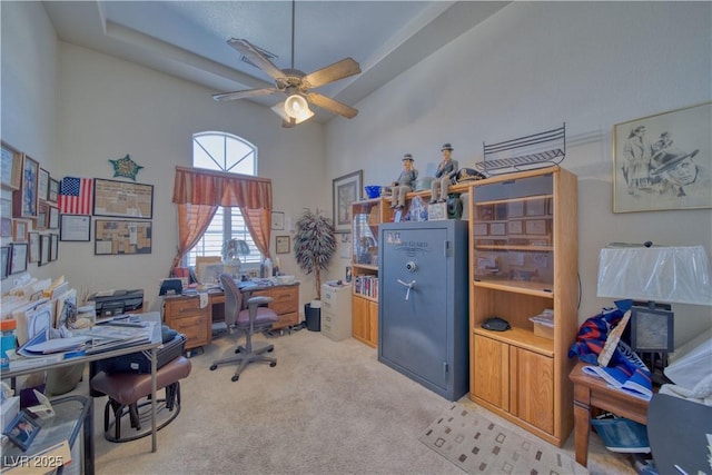 office with ceiling fan, a high ceiling, and carpet floors